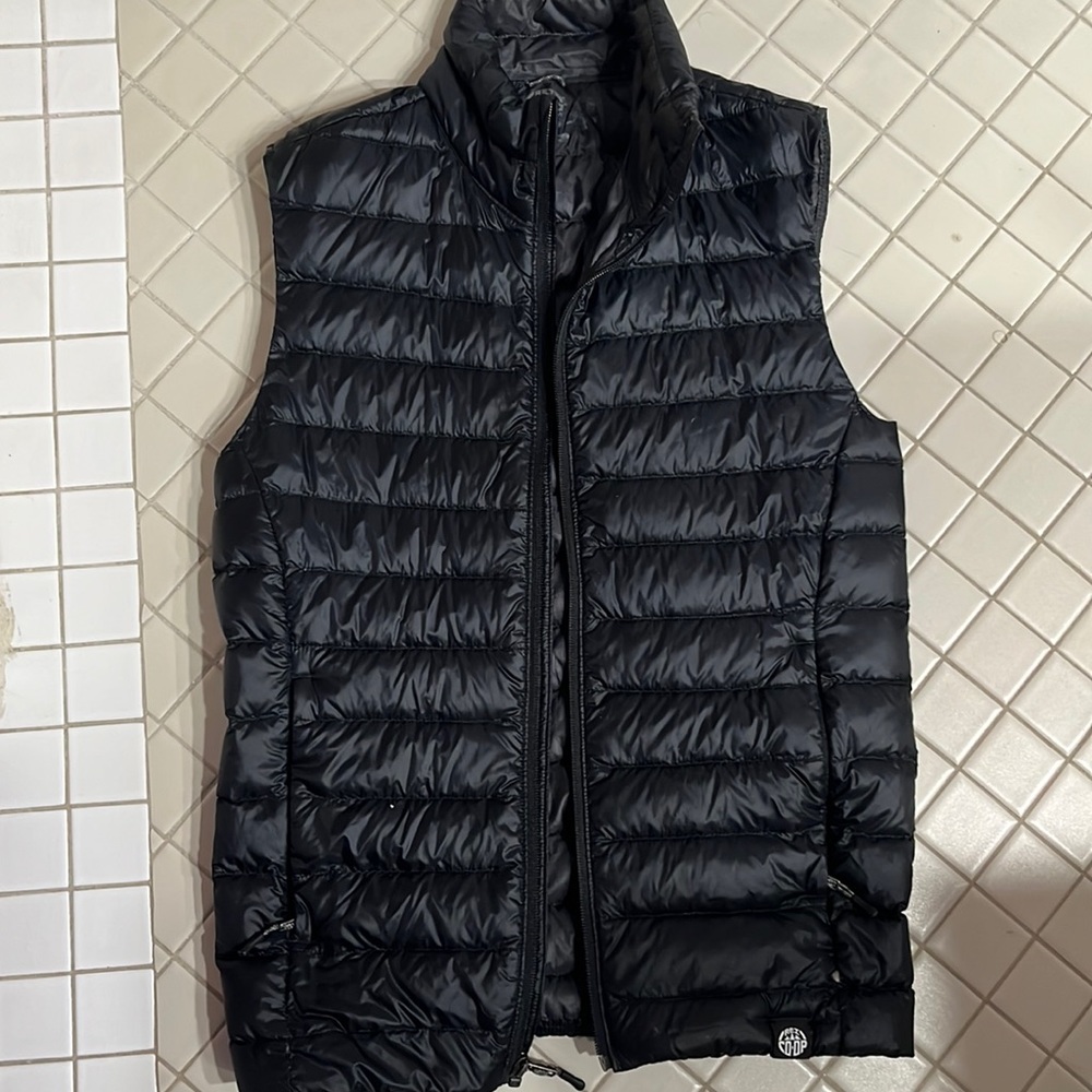 Black REI Women’s Insulated Vest with zipper pockets